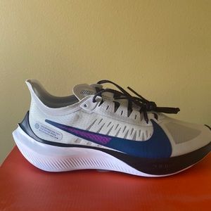 Brand new in box Nike Zoom Gravity shoes size 10.5 the base is grey. Blue/purple